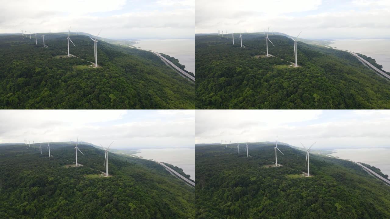 空中拍摄山上的风电场和太阳能发电场，发电风车，生产清洁可再生能源的风力涡轮机