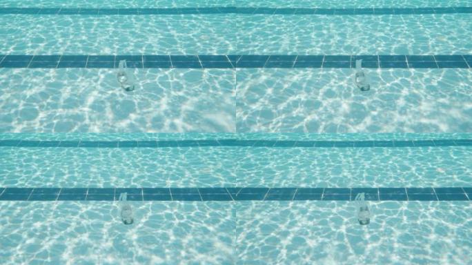 水肺潜水面具，在游泳池底部。游泳池和水下相机。慢动作