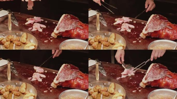 厨师在豪华餐厅用烟熏腿切成薄片烤猪肉火腿