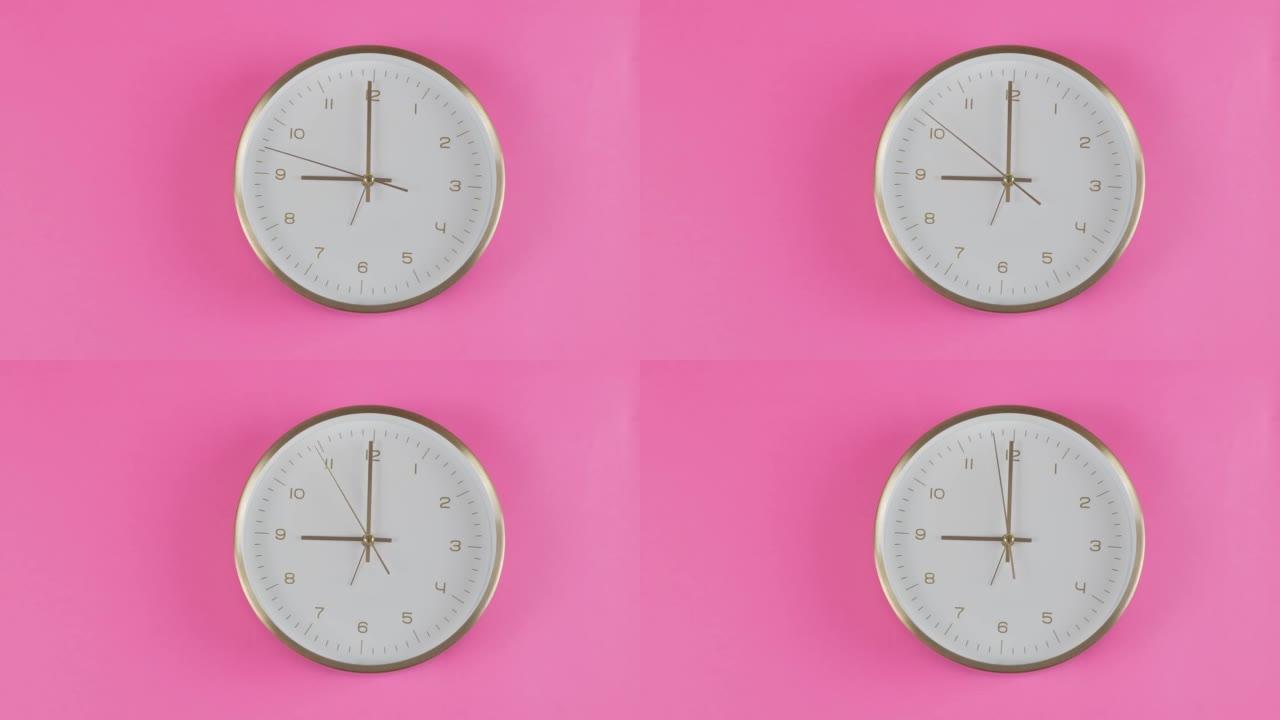 时钟在粉红色背景上显示9点