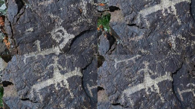 近距离拍摄的古代岩画可以追溯到8000年前在巴彦乌尔吉附近的蒙古西部