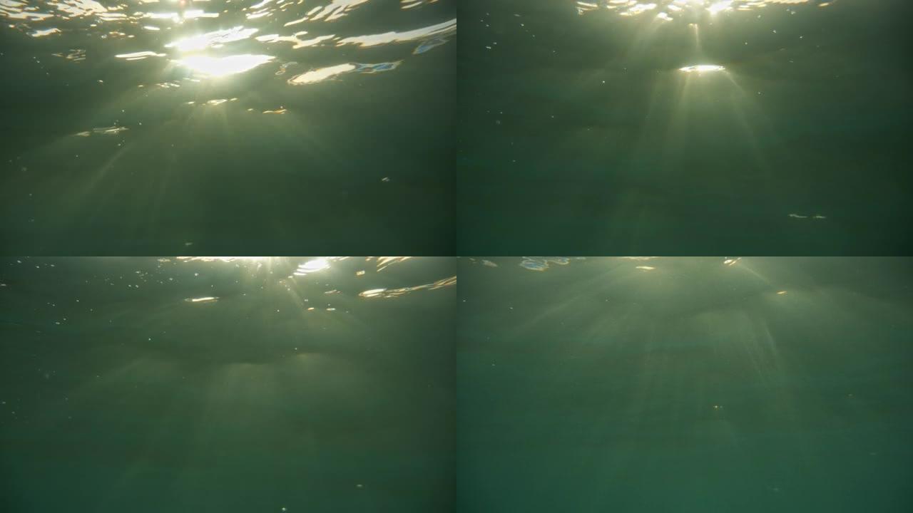 溺水。水下阳光。不同形式和形状的气泡在水中。版本1