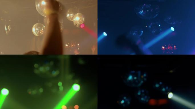 人们在灯光和闪亮的迪斯科舞会下在夜总会里玩耍和跳舞
