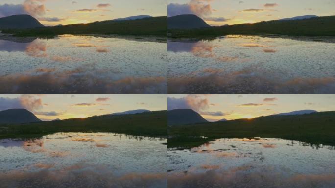 日落时挪威湖泊的风景鸟瞰图