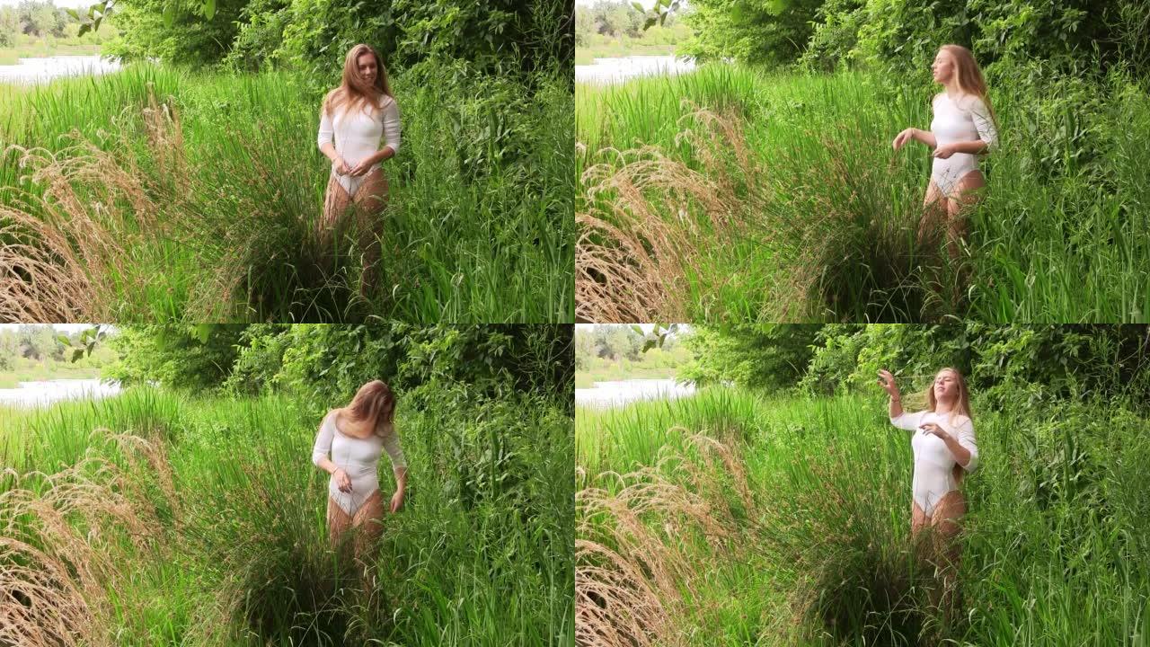 白人少女站在河边的绿草丛中