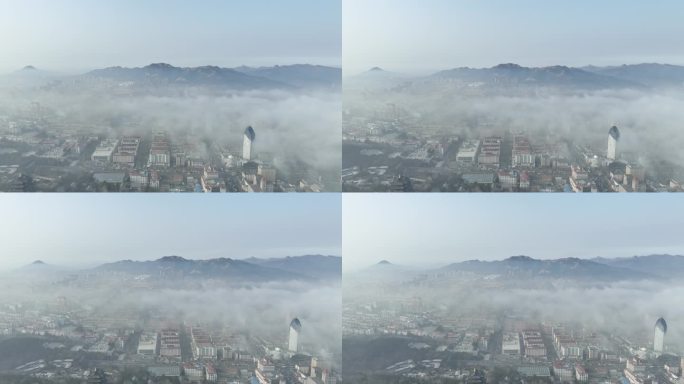 航拍平流雾下的威海市环翠区城市