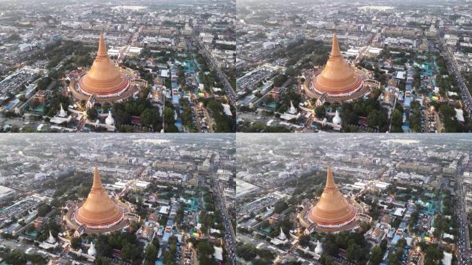 泰国佛统城大塔的空中无人机日落场景