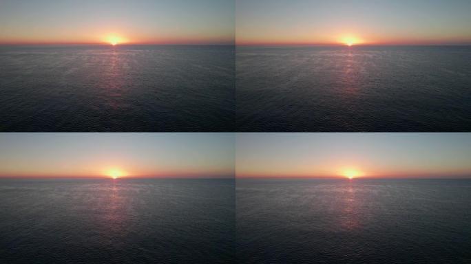 海上日出。跟随太阳。摄像机的上升运动。倾斜。与海鸥一起飞行。版本5