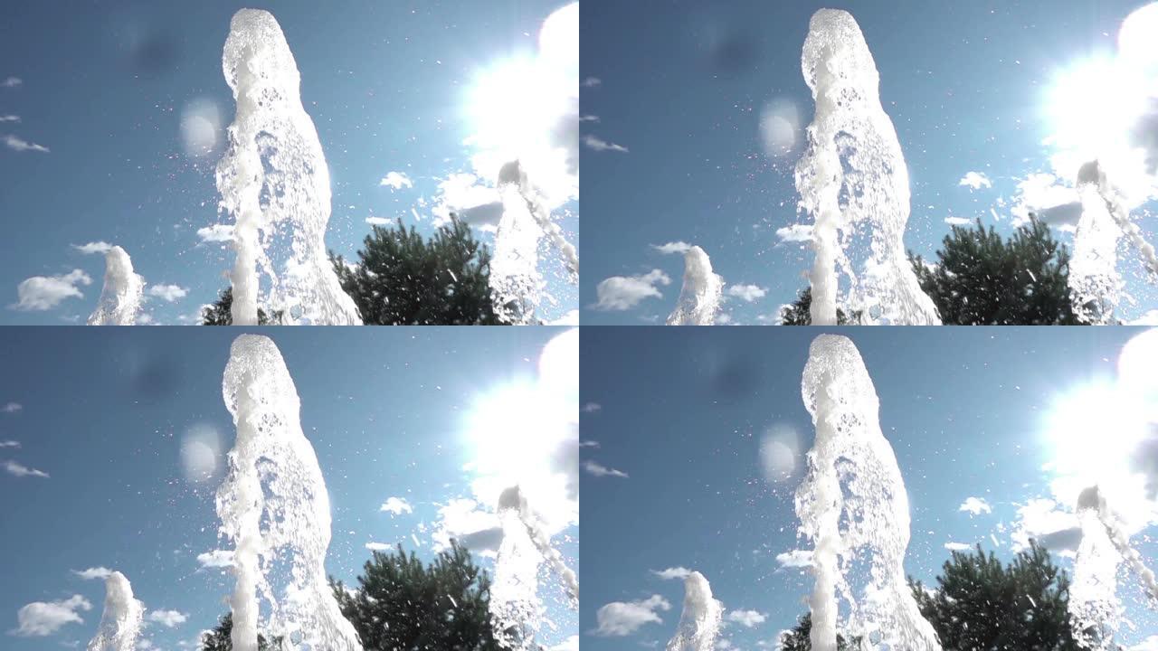 城市里炎热的夏天。喷泉喷雾特写。舞蹈喷泉。飞溅在阳光下闪闪发光。慢动作。4K