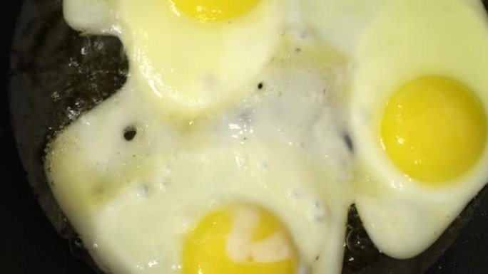 炒鸡蛋烹饪过程的幻灯片拍摄。Macro dolly准备炒鸡蛋。酮饮食元素减肥概念。