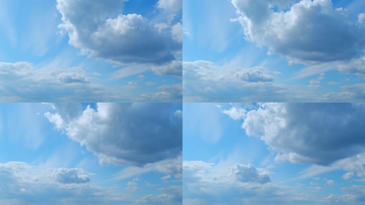 蓬松的分层云天空大气。雄伟惊人的蓝天，云彩。白色和蓝色。时间流逝。