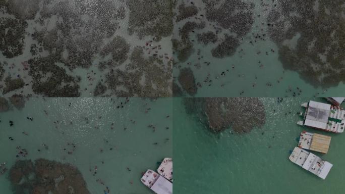 在加林哈斯港由珊瑚礁形成的自然池中游客的俯视图