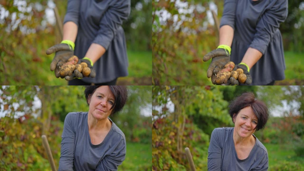 这个女人展示了她采摘的土豆