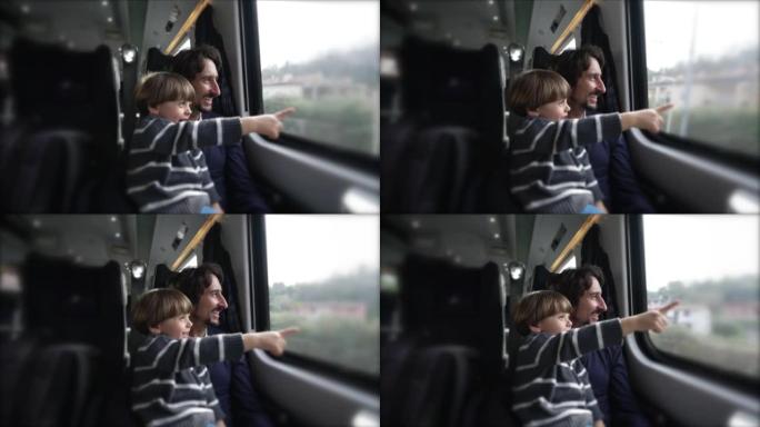假期里，快乐的父子一起坐火车旅行。小男孩用手指着在运动中经过内部运输的风景
