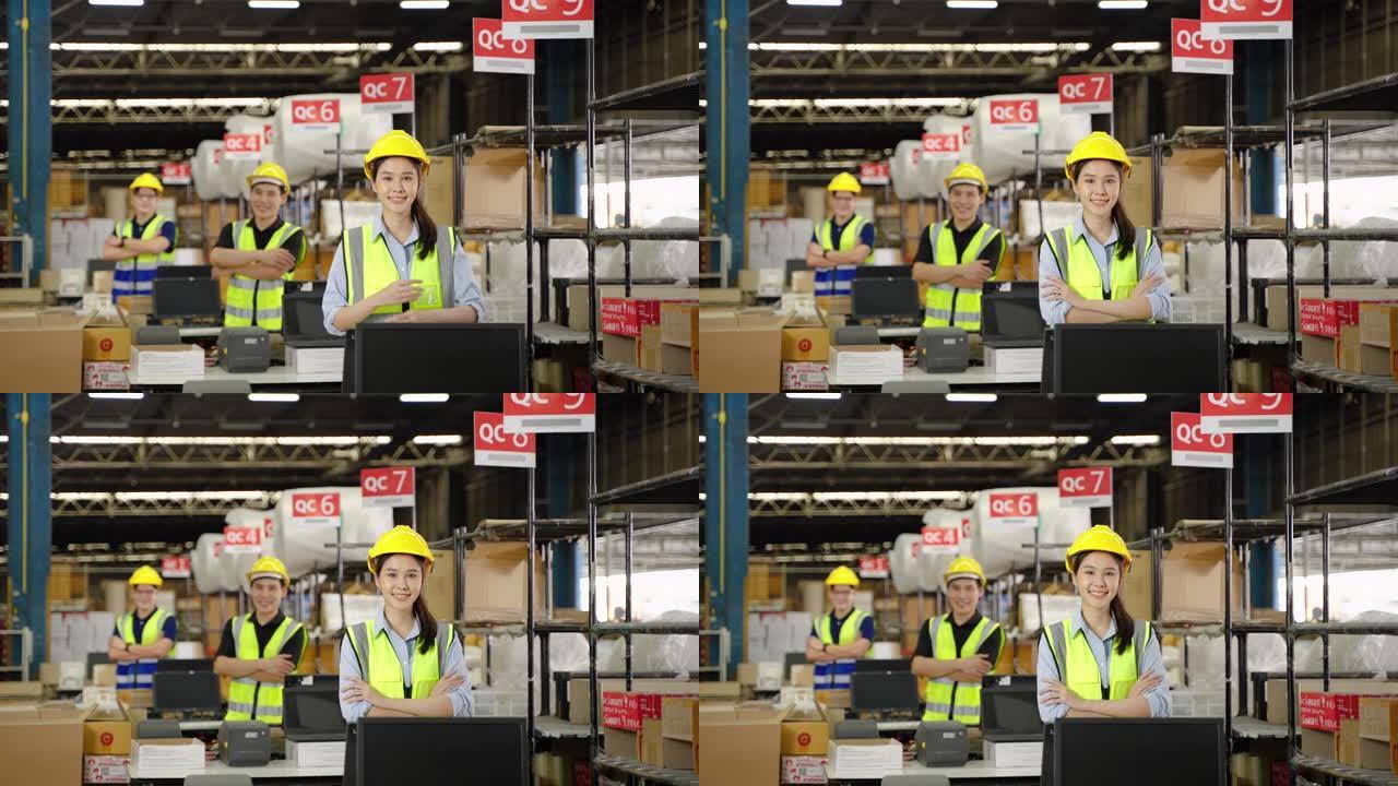 包装点配送中心的亚洲仓库工人自信地站着，双臂交叉，团队合作，仓库，配送，物流
