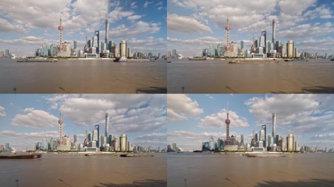 在晴朗的阴天从浦西观看的上海外滩地标性建筑，在黄浦江上航行的船只，延时4k镜头，b滚动镜头。