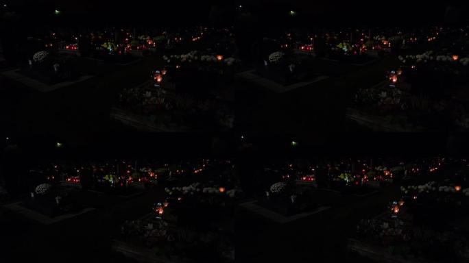 晚上的坟墓和蜡烛。
