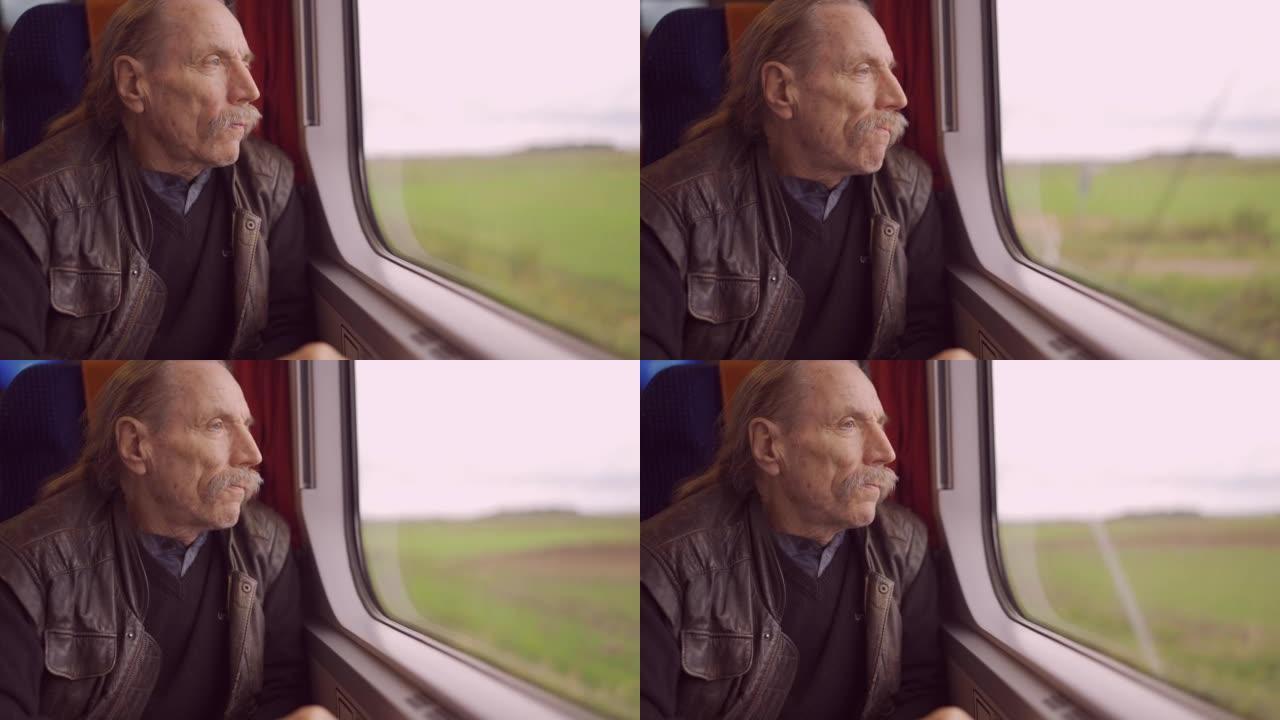戴眼镜的老人乘火车旅行，看着窗外