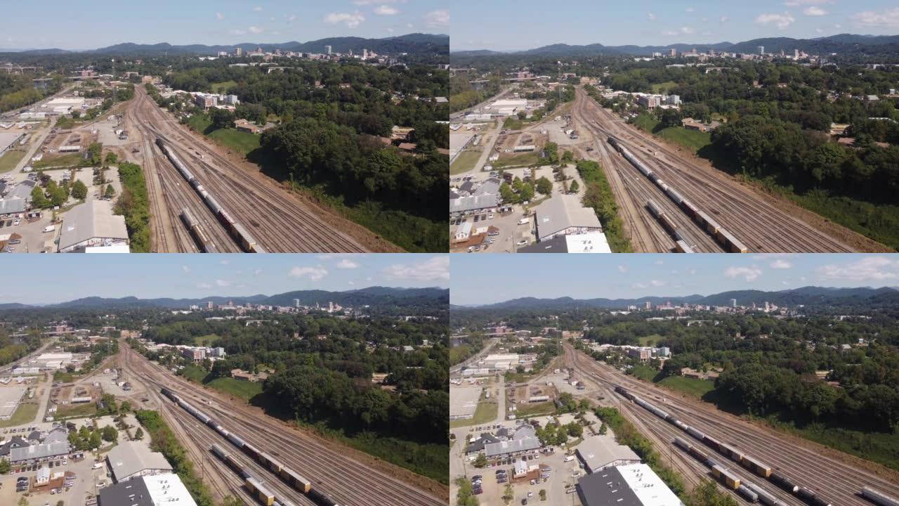 在北卡罗来纳州西阿什维尔的火车轨道上，诺福克南部阿什维尔院子附近的法国宽河艺术区上方的火车高架视图