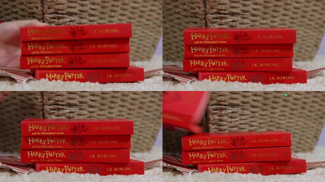 女人把哈利·波特的红书放在篮子附近的地毯上