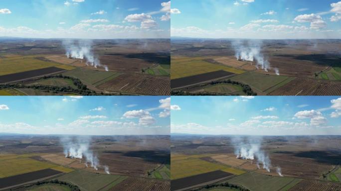 旱季农田秸秆燃烧浓烟污染空气的农业废篝火的鸟瞰图导致全球变暖，收获后与燃烧农艺田发生事故，干米茬着火