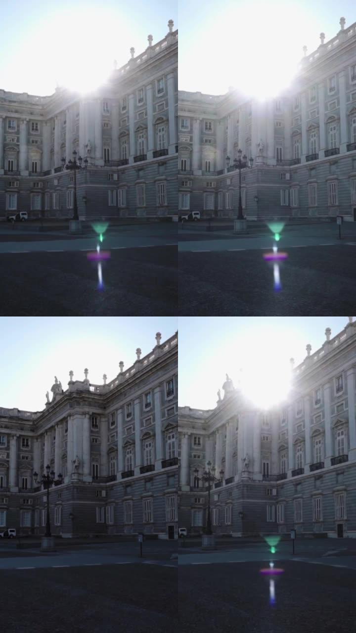 马德里王宫的垂直镜头，西班牙后面有太阳耀斑