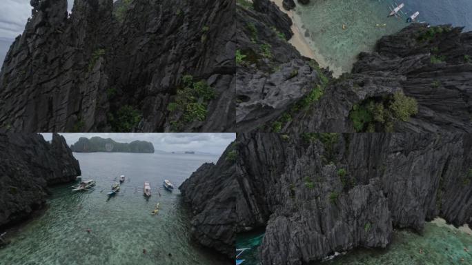 空中极限潜水视图岩石地层尖峰结构速度潜水到泻湖海滩热带岛屿