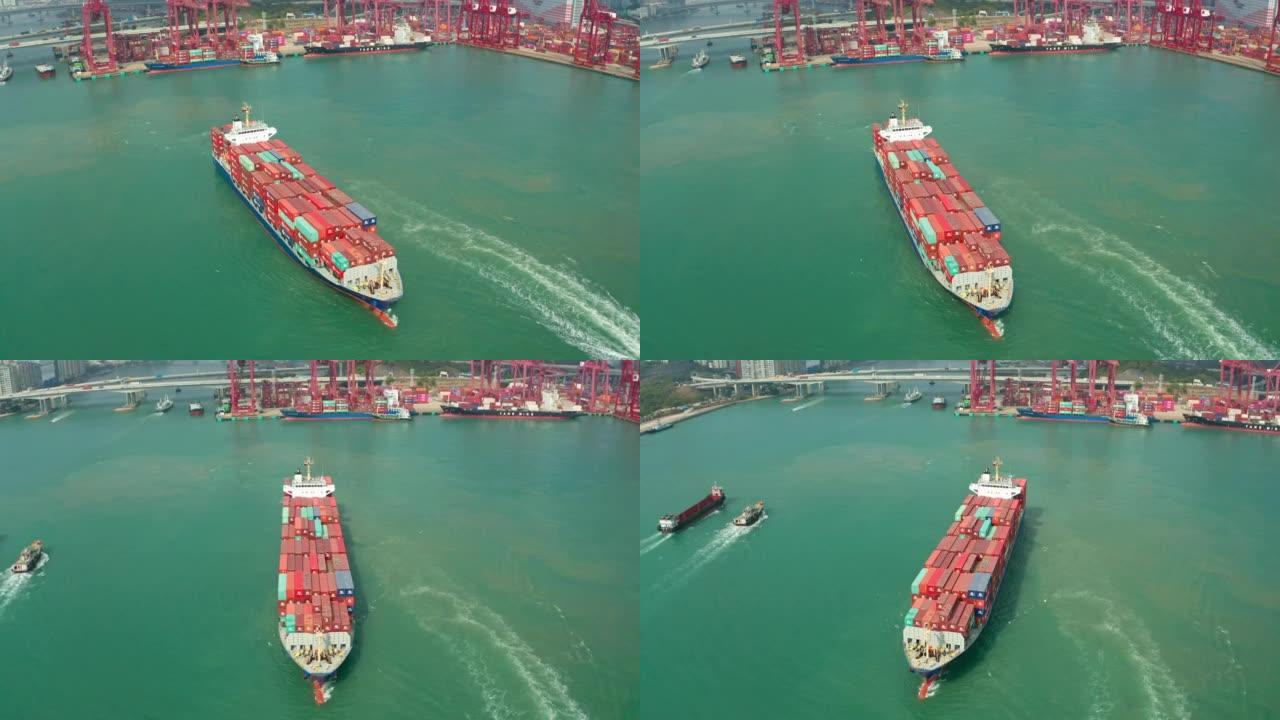 鸟瞰集装箱货船全承运人集装箱前往码头商业港口的装卸码头进行商务物流，进出口，运输或货运。