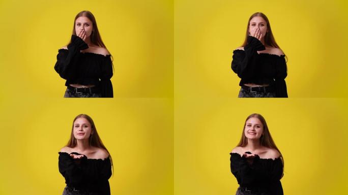 一个女孩在黄色背景上发送air kiss的4k视频。