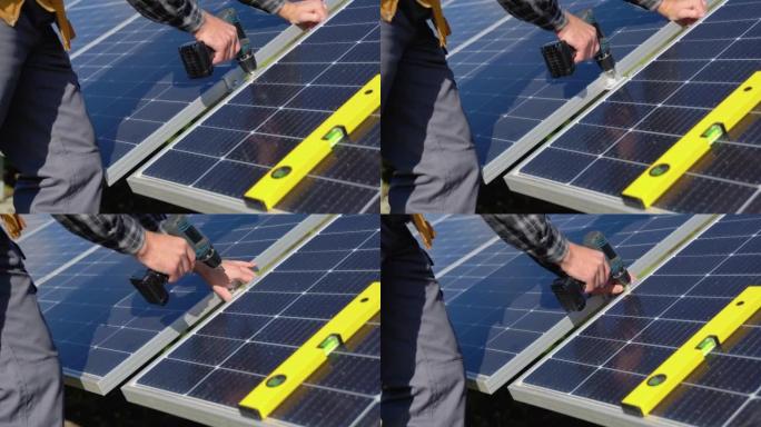 使用螺丝刀安装太阳能光伏板系统的防护头盔男工程师。替代能源生态概念