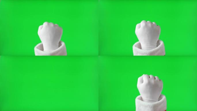 手势包。圣诞老人手握白手套敲孤立的色度键绿色屏幕背景。4k镜头。圣诞老人的拳头打手势敲门。假期就要到