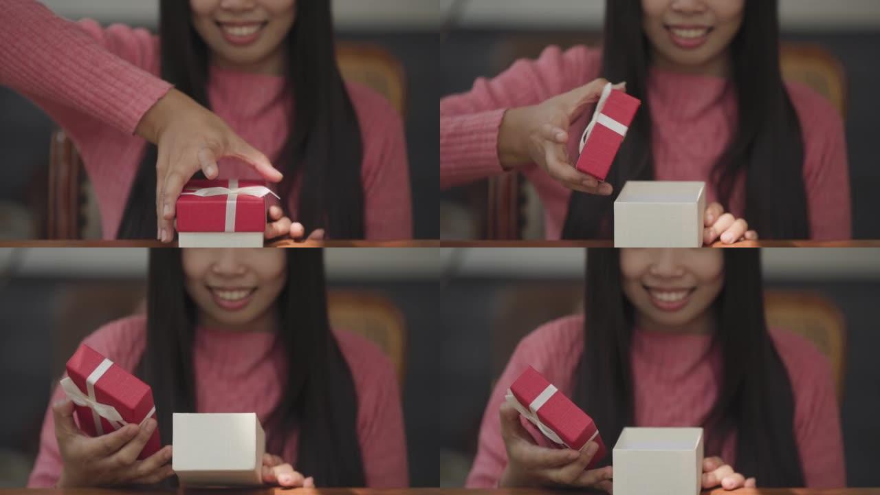 女孩打开礼盒，露出笑脸。