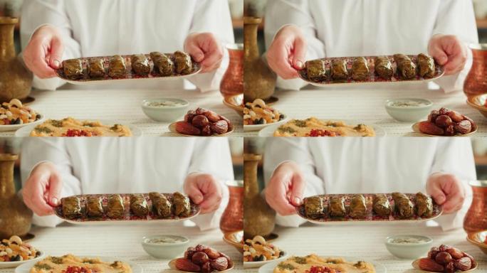 卓玛特写，葡萄叶中的肉，中东民族传统食品。穆斯林家庭晚餐，斋月，开斋。阿拉伯美食。