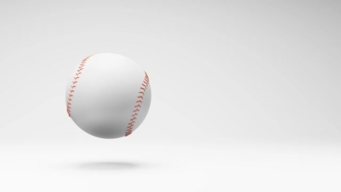 工作室浅灰色背景上的棒球旋转