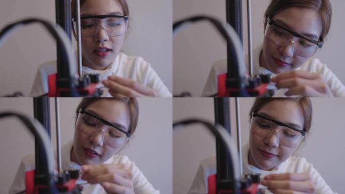 美女连接3D打印机连接器进行维修或安装。