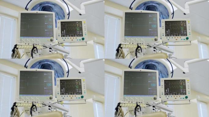 一对显示器显示手术中患者的状况。医院诊所的医疗呼吸和生命支持系统。