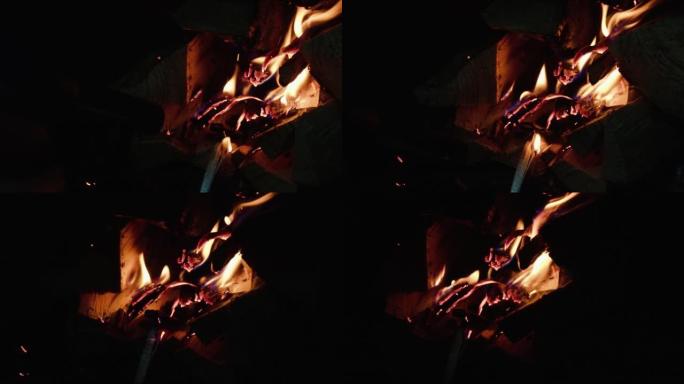 Kindling firewood in the fireplace with a gas burn