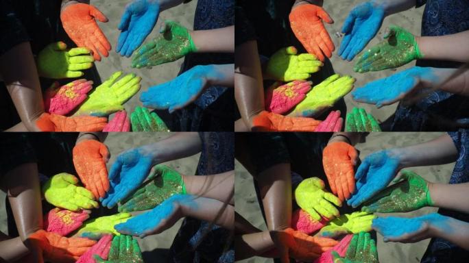 胡里节上人们的手被油漆覆盖
