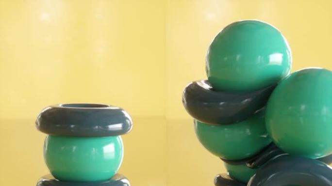 橡胶球和环堆成黄色。令人满意的3d动画。垂直方向