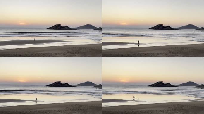 穿裙子的美女在夕阳下的海滩惬意曼舞自拍