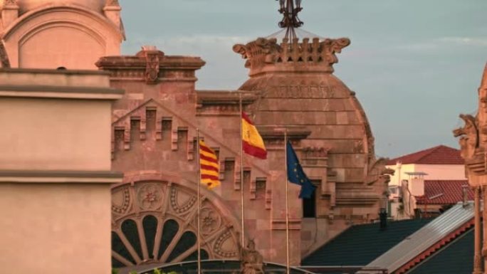旗帜在巴塞罗那大楼的屋顶上飘扬——西班牙加泰罗尼亚，欧盟。高质量4k镜头