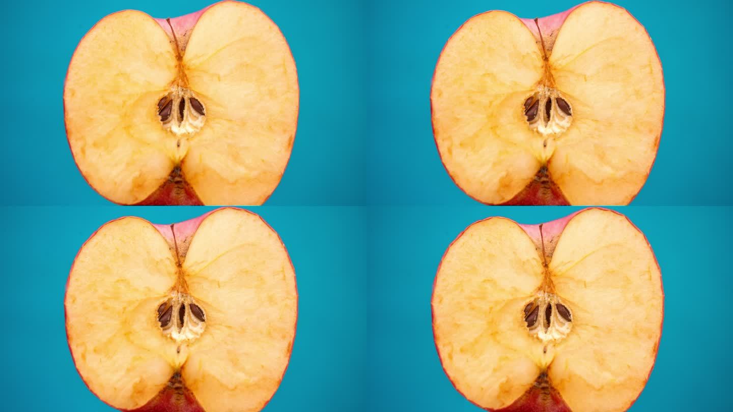一只手拿着一个烂苹果的特写镜头。氧化苹果，颜色深照片摄影图片_ID:430057979-Veer图库
