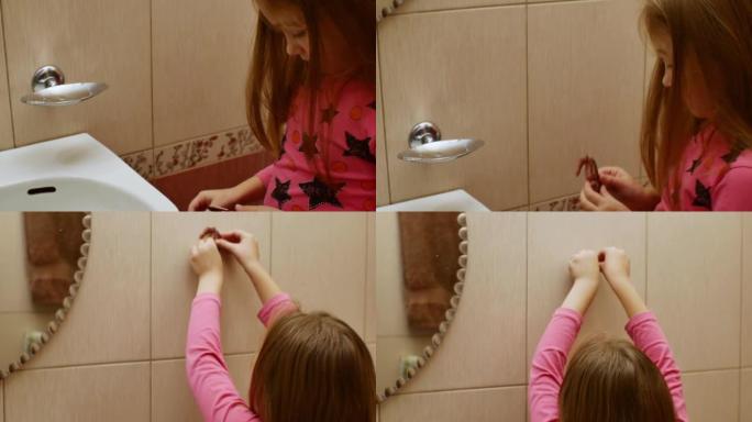 一个女孩正在将美丽的装饰棕色海马粘在瓷砖浴室墙上。住宅楼内的墙面装饰。装饰房子墙壁的装饰小摆设