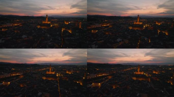 老城区的空中全景镜头，有旅游景点。照耀着暮色天空的旧宫塔。意大利佛罗伦萨