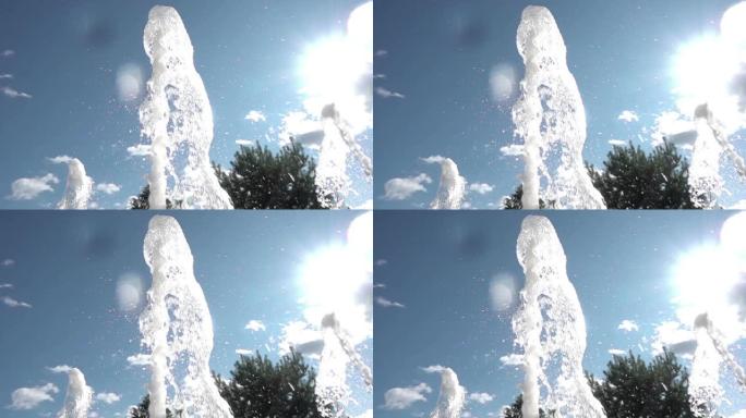 城市里炎热的夏天。喷泉喷雾特写。舞蹈喷泉。飞溅在阳光下闪闪发光。慢动作。4K