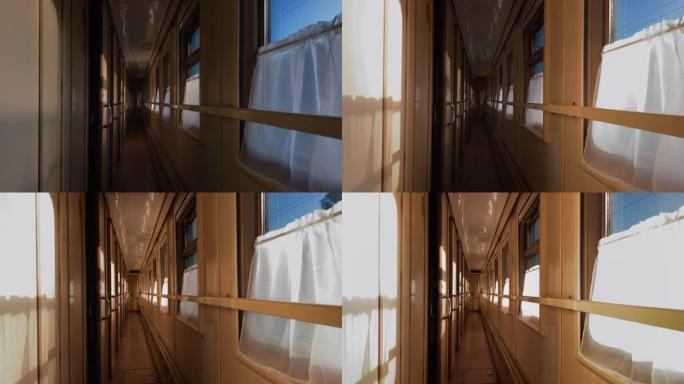 火车的走廊在明亮的阳光下穿过窗户。旅程概念
