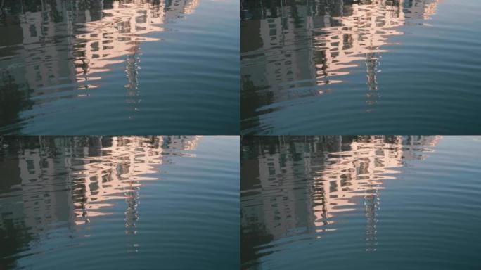 池塘中无尽的涟漪，建筑物在太阳光下的反射，4k慢动作镜头循环可滚动拍摄。