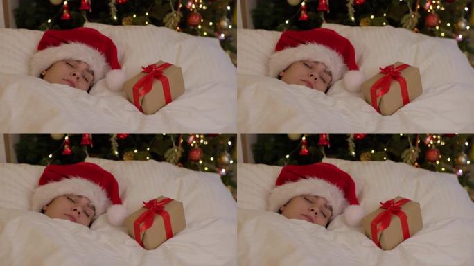 漂亮的年轻女子圣诞老人帽子卧室靠近装饰的圣诞灯树