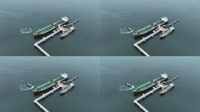 石油原油油轮船，货物集装箱船海上系泊在大洋湾石油化工出口进口运输和物流