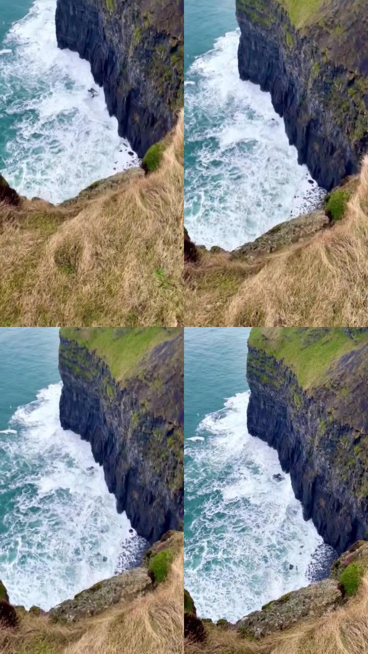 从爱尔兰莫赫的悬崖上看得头晕目眩: 海浪冲向悬崖。鸟瞰图